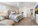 Serene bedroom featuring a plush bed, chaise lounge, and neutral color palette at 16044 N 106Th Way, Scottsdale, AZ 85255