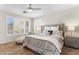 Bright bedroom showcasing large windows, shutters, and a stylish bed at 16044 N 106Th Way, Scottsdale, AZ 85255