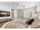 Comfortable bedroom with plantation shutters, television, and designer dresser at 16044 N 106Th Way, Scottsdale, AZ 85255