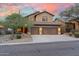 Inviting home featuring a three-car garage, desert landscaping, and beautiful curb appeal at 16044 N 106Th Way, Scottsdale, AZ 85255