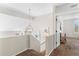 Bright hallway with modern chandelier, fresh paint, and doorway to the bedroom space at 16044 N 106Th Way, Scottsdale, AZ 85255