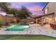 Gorgeous backyard pool with stone accents, a soothing waterfall feature, and ample patio space at 16044 N 106Th Way, Scottsdale, AZ 85255