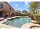 Inviting pool area with mature landscaping and direct access to the home's covered patio at 16044 N 106Th Way, Scottsdale, AZ 85255