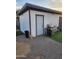 Backyard featuring a white storage shed, a grill, and a gravel ground cover, offering a functional outdoor space at 1618 S Cedar Dr, Apache Junction, AZ 85120