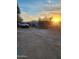 Spacious backyard featuring a trampoline, vehicle and desert landscaping at 1618 S Cedar Dr, Apache Junction, AZ 85120