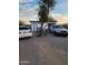 Backyard space featuring a white storage shed with a grill, surrounded by gravel and artificial turf at 1618 S Cedar Dr, Apache Junction, AZ 85120