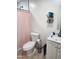 Bathroom featuring a toilet, vanity, sink, and shower with a pink curtain at 1618 S Cedar Dr, Apache Junction, AZ 85120