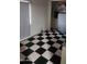 Bedroom with black and white checkered flooring, and built in closet space at 1618 S Cedar Dr, Apache Junction, AZ 85120