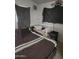 Cozy bedroom featuring a crib and a queen bed at 1618 S Cedar Dr, Apache Junction, AZ 85120