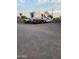 Gravel driveway and outdoor work area with recreational vehicle parking at 1618 S Cedar Dr, Apache Junction, AZ 85120