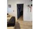 Hallway with beige tile floors and doorway leading to other rooms and closet at 1618 S Cedar Dr, Apache Junction, AZ 85120