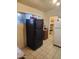 Kitchen area featuring a refrigerator and a view into the pantry space at 1618 S Cedar Dr, Apache Junction, AZ 85120