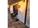 Cozy patio featuring classic stone tiles, a window, and a chair, offering a relaxing spot to enjoy the outdoors at 1618 S Cedar Dr, Apache Junction, AZ 85120