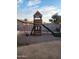 Backyard playground with wooden playset, slide, and ample play area for outdoor fun at 1618 S Cedar Dr, Apache Junction, AZ 85120