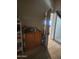 Well-organized room with storage shelves, cabinets, and a view through the doorway at 1618 S Cedar Dr, Apache Junction, AZ 85120