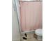 Shower with pink curtain and shower rack at 1618 S Cedar Dr, Apache Junction, AZ 85120