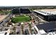 An aerial view of Goodyear community featuring commercial office buildings, a park, and lush landscaping at 17145 W Hadley St, Goodyear, AZ 85338