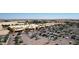 Aerial view of shopping center including various stores, parking, and surrounded by landscaped areas at 17145 W Hadley St, Goodyear, AZ 85338