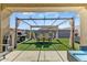 Outdoor space with dining area, built-in grill, and ample seating at 17145 W Hadley St, Goodyear, AZ 85338