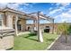 Backyard showcasing a covered patio and built in grill, perfect for outdoor entertaining at 17145 W Hadley St, Goodyear, AZ 85338
