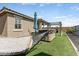 A relaxing backyard with a spa, covered patio, and hammock at 17145 W Hadley St, Goodyear, AZ 85338