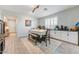 Bright dining room with white cabinets, buffet counter, and a classic dining set at 17145 W Hadley St, Goodyear, AZ 85338