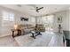 Comfortable living room with neutral tones, decorative rug, and plenty of natural light at 17145 W Hadley St, Goodyear, AZ 85338
