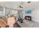 Cozy living room featuring comfortable seating, stylish decor, and a mounted television at 17145 W Hadley St, Goodyear, AZ 85338