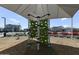 Community playground featuring a climbing structure under a shaded canopy at 17145 W Hadley St, Goodyear, AZ 85338