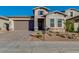 Charming single-Gathering home featuring a two-car garage and well-manicured landscaping at 18025 N 65Th Pl, Phoenix, AZ 85054