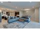 Bright, open-concept living area seamlessly connecting to the dining and kitchen spaces at 18025 N 65Th Pl, Phoenix, AZ 85054