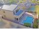 Aerial view of home showcasing a spacious backyard, refreshing pool, and solar panels at 18346 W Sweet Acacia Dr, Goodyear, AZ 85338