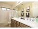 Bathroom with double sinks, neutral paint, and a shower-tub combination at 18346 W Sweet Acacia Dr, Goodyear, AZ 85338