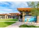 Exterior of clubhouse with modern architecture and outdoor seating at 18346 W Sweet Acacia Dr, Goodyear, AZ 85338