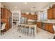 Spacious kitchen with stainless appliances, center island and seating at 18346 W Sweet Acacia Dr, Goodyear, AZ 85338
