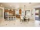 Well-appointed kitchen with a breakfast bar, stainless steel appliances, and an adjacent dining area at 18346 W Sweet Acacia Dr, Goodyear, AZ 85338