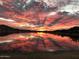 Scenic lake sunset reflecting light off the water with vibrant pinks and oranges at 18346 W Sweet Acacia Dr, Goodyear, AZ 85338