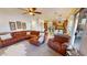 An open-concept living room with dining area and eat-in kitchen at 18346 W Sweet Acacia Dr, Goodyear, AZ 85338