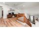 Upper level loft area featuring hardwood floors, office space, and a wooden railing at 18346 W Sweet Acacia Dr, Goodyear, AZ 85338