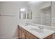 Bathroom featuring double sinks, a large mirror, and a shower, maximizing functionality at 1920 E Bell Rd # 1006, Phoenix, AZ 85022