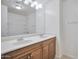 Bathroom featuring double sinks, vanity, and a shower-tub combo for added convenience at 1920 E Bell Rd # 1006, Phoenix, AZ 85022