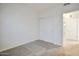 Neutral bedroom featuring plush carpet and a closet with white sliding doors at 1920 E Bell Rd # 1006, Phoenix, AZ 85022