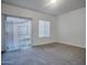 Bright bedroom featuring a slider door and window, offering ample natural light and outdoor access at 1920 E Bell Rd # 1006, Phoenix, AZ 85022
