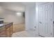 Kitchen with breakfast bar that overlooks the living area with spiral stairs at 1920 E Bell Rd # 1006, Phoenix, AZ 85022