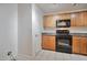 Compact kitchen with updated appliances, ample cabinet storage, and modern countertops at 1920 E Bell Rd # 1006, Phoenix, AZ 85022