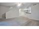Spacious living room featuring neutral carpeting, ceiling fan, and open access to the kitchen at 1920 E Bell Rd # 1006, Phoenix, AZ 85022