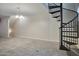 Large living room with unique spiral staircase adding a touch of modern elegance to the space at 1920 E Bell Rd # 1006, Phoenix, AZ 85022