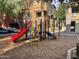 Community playground with slides, climbing bars, and play area for  at 1920 E Bell Rd # 1006, Phoenix, AZ 85022