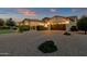 Expansive driveway leads to an attached garage with charming details and manicured landscaping, and great curb appeal at 20137 E Via Del Palo --, Queen Creek, AZ 85142