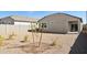 An open backyard has fresh landscaping and a concrete fence for privacy at 25364 W Sunland Ave, Buckeye, AZ 85326